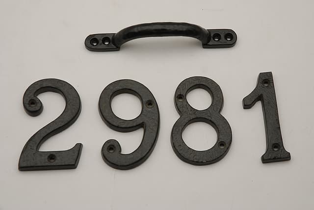 Image of metal numbers, often used for house or door signage