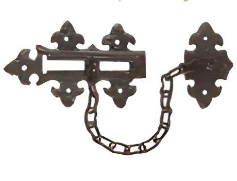 Black antique door security chain on fleur-de-lis plates