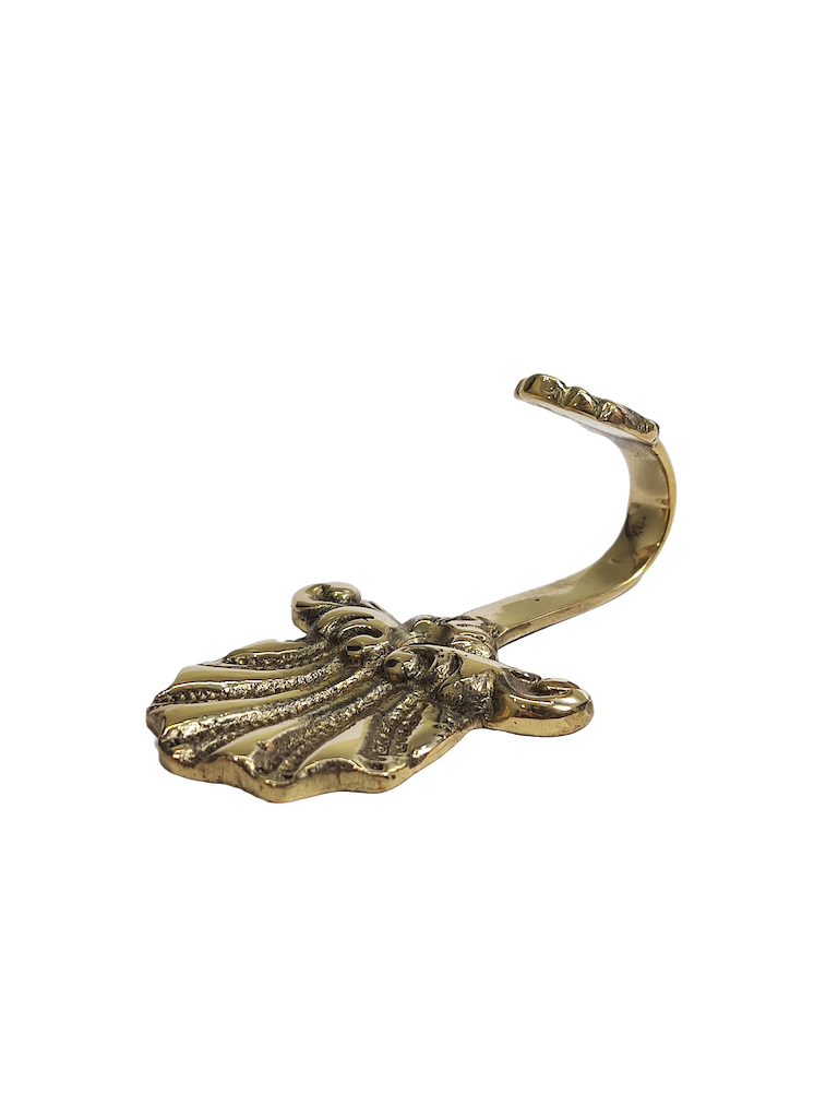 Peacock-shaped brass hook with decorative detail