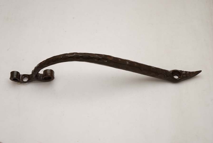 Ornate cast iron handle with decorative profile